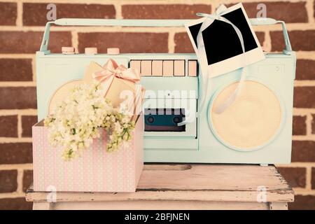 Retro recorder on brick wall background Stock Photo