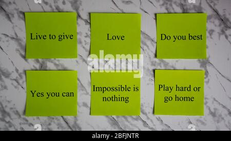 Motivational words on colored sheets of paper. Creativity and art. Study, education, work. Office, school, University. Stationery. Stock Photo