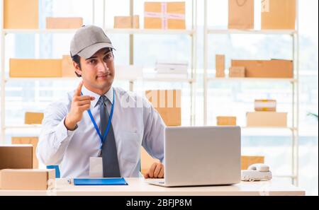 The male employee working in box delivery relocation service Stock Photo