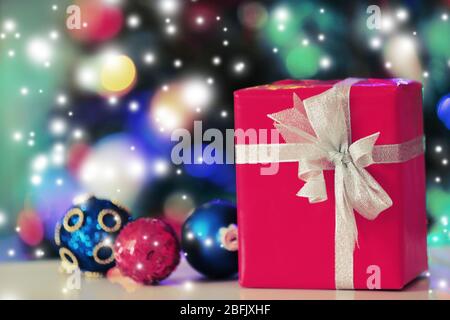 Christmas gift box and decorations on lights background Stock Photo