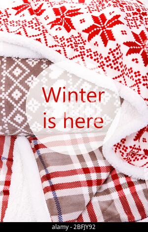 Winter is here, greeting card. Warm plaids close-up Stock Photo