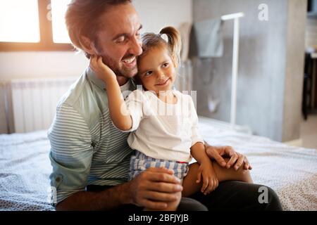 Father and his daughter child girl playing together. Happy loving family Stock Photo