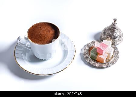 A cup of Turkish coffee in traditional white porcelain Turkish coffee cup Stock Photo