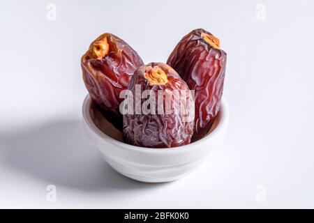 Dried dates fruit isolated on white Stock Photo