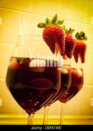 Three strawberry cocktails in a row. Stock Photo