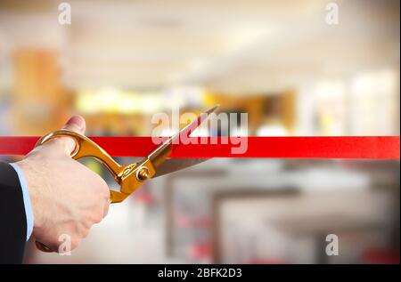 Grand opening, cutting red ribbon Stock Photo