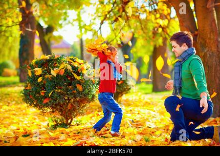 happy family having fun in colorful autumn park Stock Photo