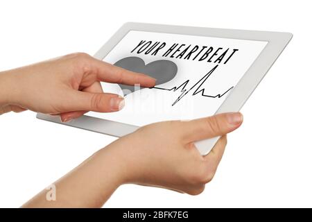 Hands holding tablet with health book app on the screen isolated on white Stock Photo