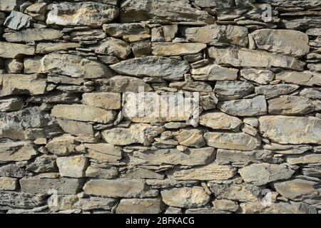 An ancient drystone wall in a terraced vineyard in Sion, in the Rhone Valley wine region, canton of Valais, Switzerland. Stock Photo