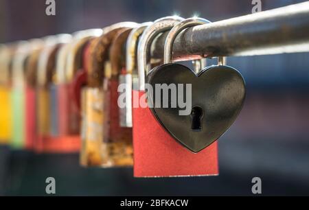 Love padlocks on a bridge rail. Stock Photo