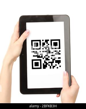 Hands holding tablet PC with QR code on screen Stock Photo