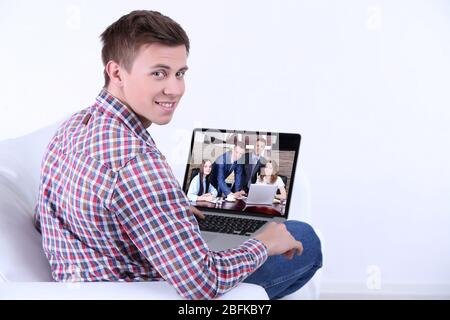 Portrait of businessman attending video conference Stock Photo