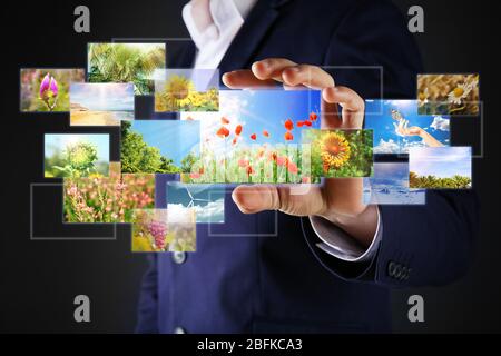 Businessman holding streaming images Stock Photo