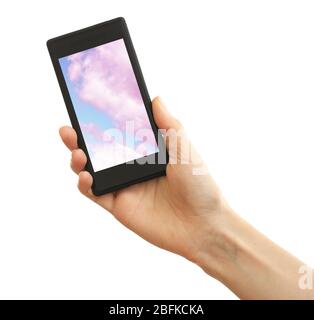 Hand holding mobile smart phone with sky in screen. Cloud computing concept Stock Photo