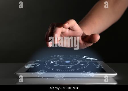 Businessman hand pushing business graph on tablet-pc.  Futuristic button Stock Photo
