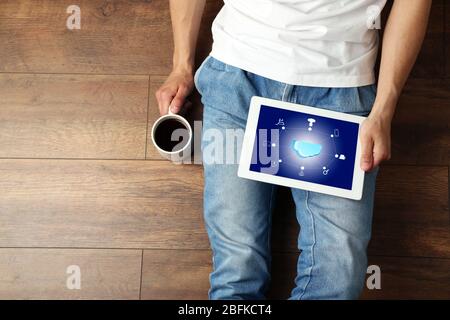 Man with  cloud computing diagram on tablet-pc, modern technology concept Stock Photo