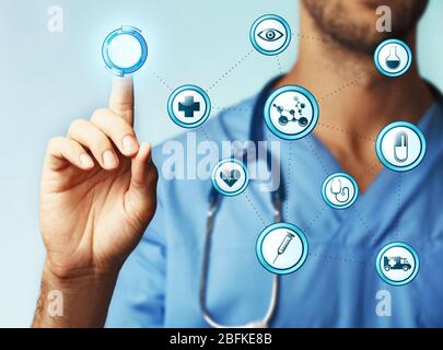 Doctor hand working with modern medical icons, close up Stock Photo