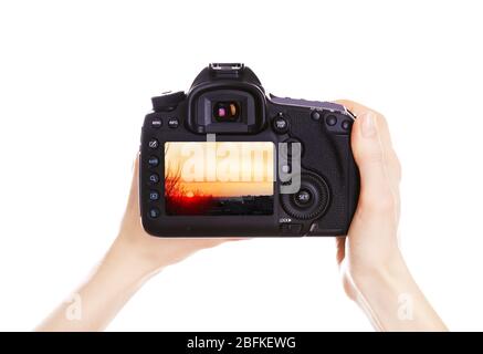 Photographer with camera at work, isolated on white Stock Photo