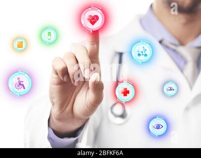 Doctor hand working with modern medical icons, close up Stock Photo