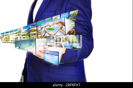 Businessman holding airplane of streaming images Stock Photo