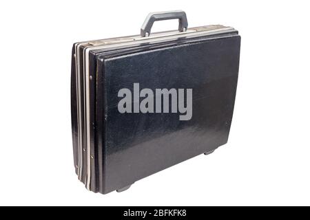 used and dirty old fashion black plastic suitcase or briefcase isolated on white background, closed and standing up Stock Photo