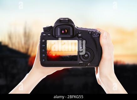 Photographer with camera at work Stock Photo