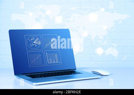 Laptop with chart and graphs on screen,  technology concept Stock Photo