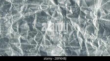 Metal shiny luxury abstract wallpaper. Silver foil metal texture. Stock Photo