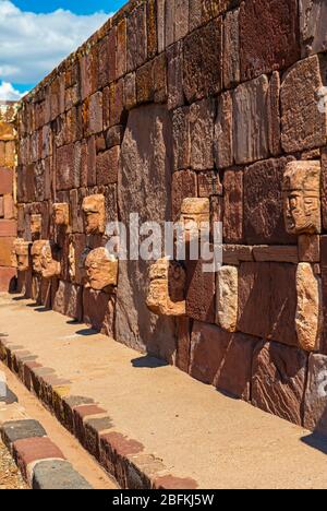 Carved Stone Head Sculptures of ancestors in the semi subterranean courtyard temple in Tiwanaku, La Paz, Bolivia. Stock Photo