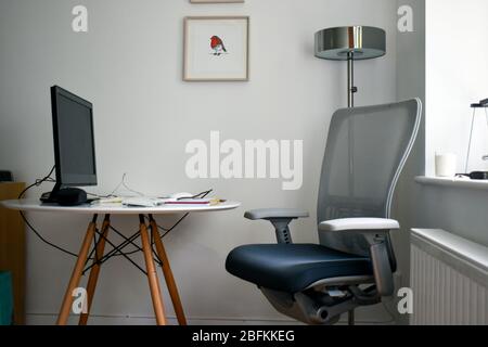 a living room converted into a home office. corona virus work from home during quarantine concept Stock Photo