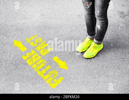 Female feet on road background Stock Photo