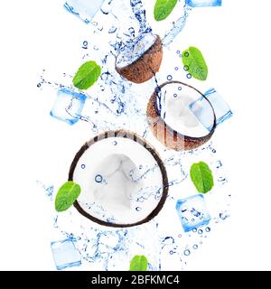 Coconuts and mint leaves in water splashing isolated on white Stock Photo