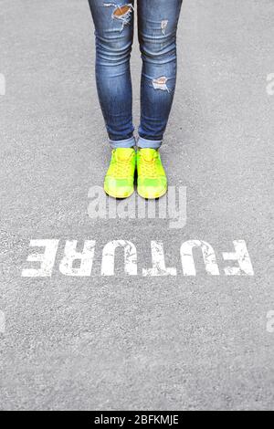 Female feet on road background Stock Photo