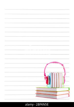 Books and headphones on lined paper background Stock Photo
