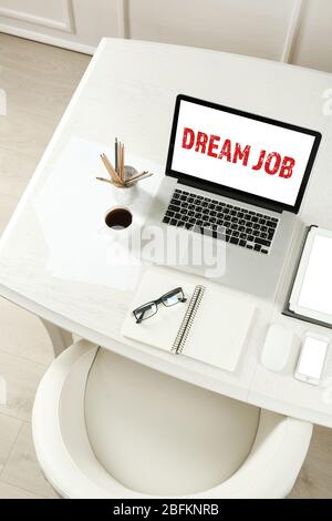 Dream job concept. Workplace with laptop in room Stock Photo