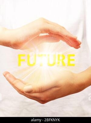 Future concept. Future word with light rays in hands, close up Stock Photo