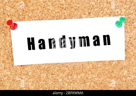 Word Handyman on piece of paper on billboard background Stock Photo