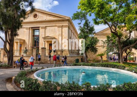 Valletta, Malta - October 10, 2019: Upper Barrakka Gardens, garden with fountain and former Garrison Chapel, city landmark Stock Photo