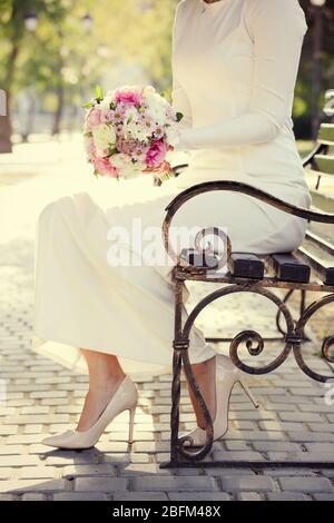 Beautiful wedding bouquet in hands of bride Stock Photo