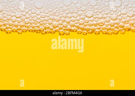 Texture of foam and bubbles in light beer. Abstract background for design. Stock Photo