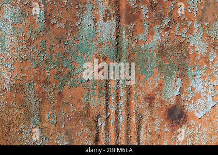 Closeup background of ridged metal with crazed paint and rust texture, copy space, horizontal aspect Stock Photo