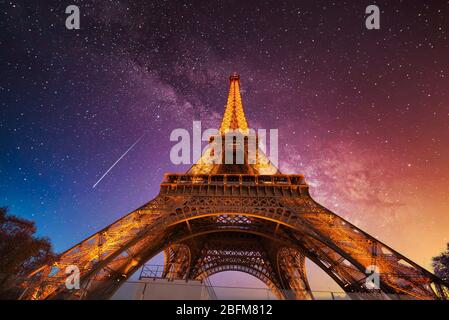 Eiffel Tower in Paris France is an amazing structure and a wonder of the world under a beautiful starry sky Stock Photo