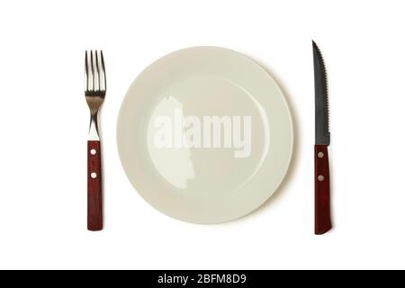 Knife, fork and plate isolated on white background Stock Photo