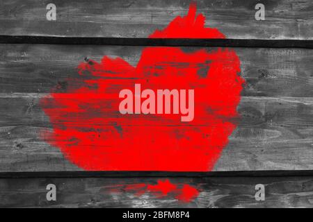 Red heart painted on old wooden wall background Stock Photo