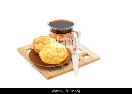 Fresh baked cheese tea biscuit served with coffee photographed on a white background with ample copy space. Stock Photo