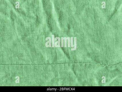 Green fabric surface for background. Green linen texture. Green flaxen background Stock Photo