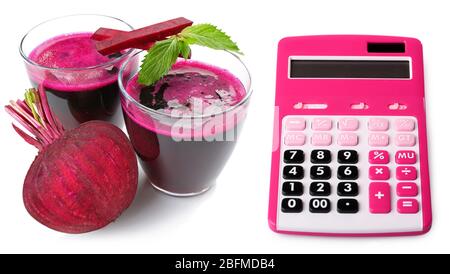Calculator and two glasses of beet juice isolated on white Stock Photo