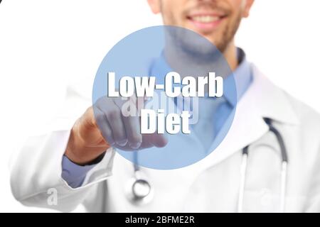 Doctor pointing on Low-Carb Diet button isolated on white Stock Photo