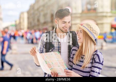Young couple of travelers in the city, outdoors Stock Photo