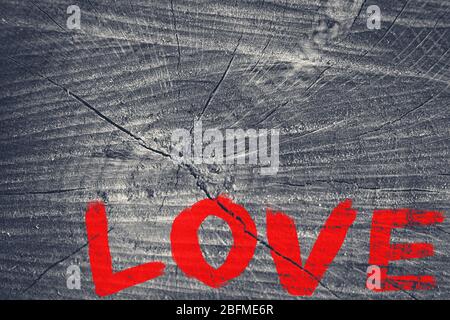 Word "Love" painted on old wooden wall background Stock Photo